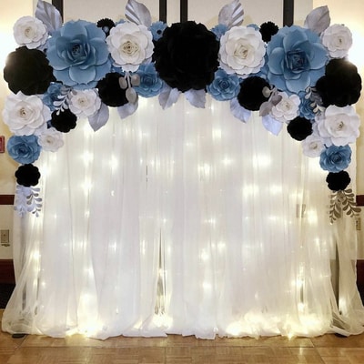 A black blue and white photo background with lights in the back to allow for great pictures